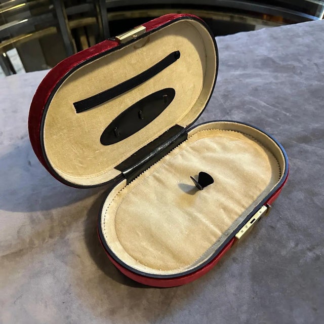 Transport yourself to the elegance of 1970s Italy with this exquisite travel jewelry box. Wrapped in rich red velvet with...