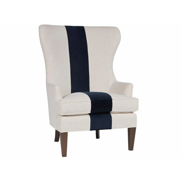 A daring, vertical navy stripe defines the Shoreline Wing Chair, a regal upholstery furnishing featuring an exaggerated...