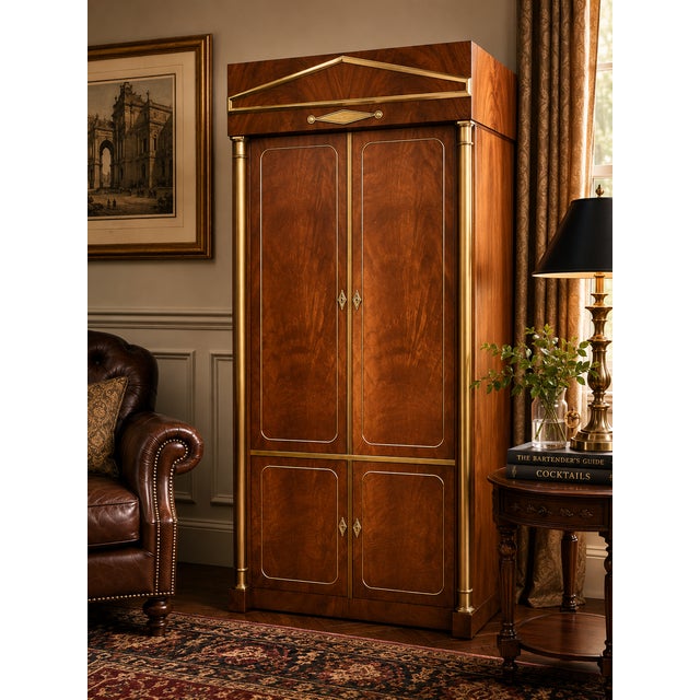 A striking vintage Mastercraft media armoire featuring richly figured walnut veneer, solid brass architectural detailing,...