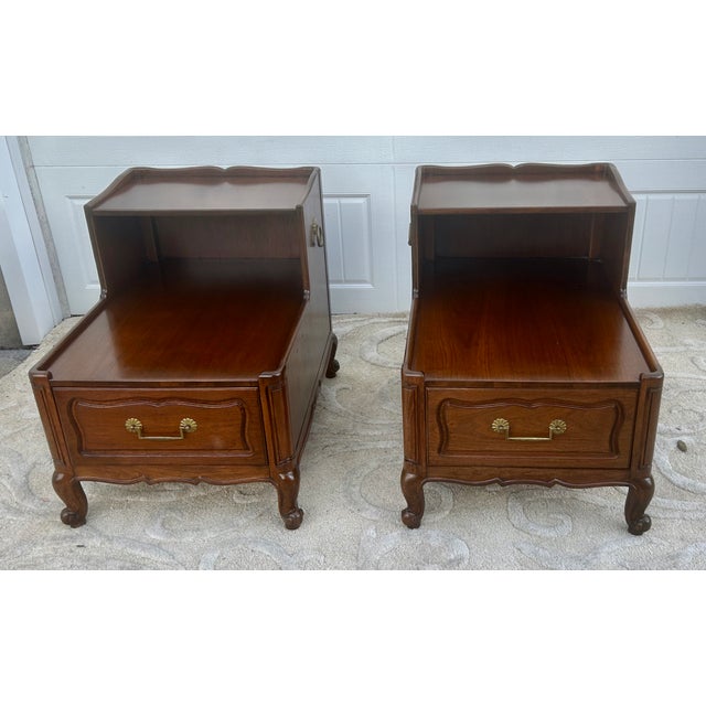 Vintage (1960's) Pair of Two Tier Side Tables have a Louis XV Style. Made by Henredon Furniture. The Wood is Walnut with...