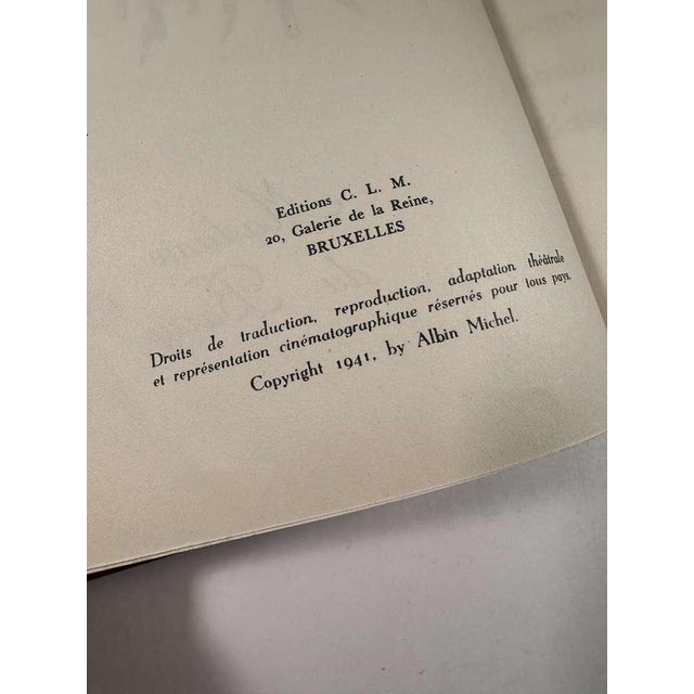 A jewel-sized piece of French history, exquisitely bound in deep red leatherette with gilt embossing. This 1941 limited...