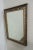 A Regency style mirror , black frame with repeating ring border with silver gilt finish