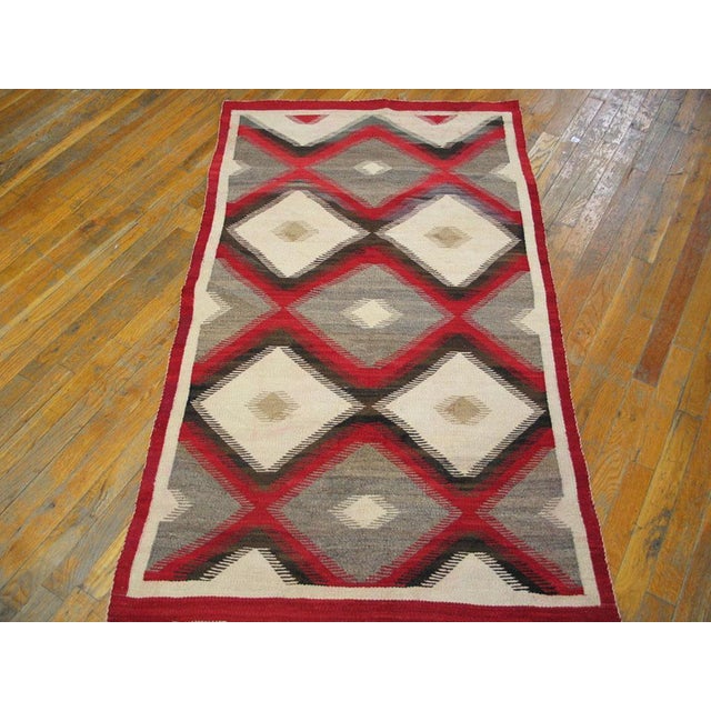 Antique Navajo American Ivory 1920s Rug, Circa Date: 1920s. This exceptional piece of Americana represents the pinnacle of...