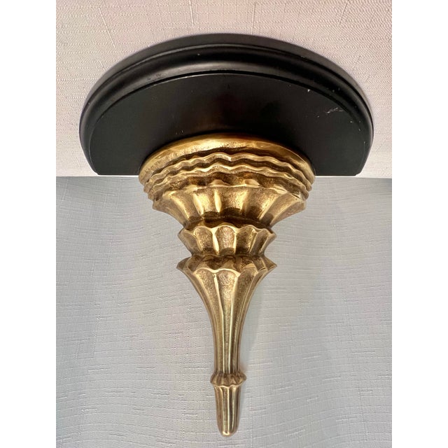 A rare find in a market flooded with lightweight composite reproductions. This sophisticated wall bracket is crafted from...