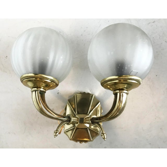 Pair of vintage bonze two-light sconces with original glass shades. Stamped: A.M. Wired for U.S. and in working condition;...