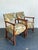 This elegant pair of vintage armchairs, designed in the celebrated Dorothy Draper style, showcases the theatrical...