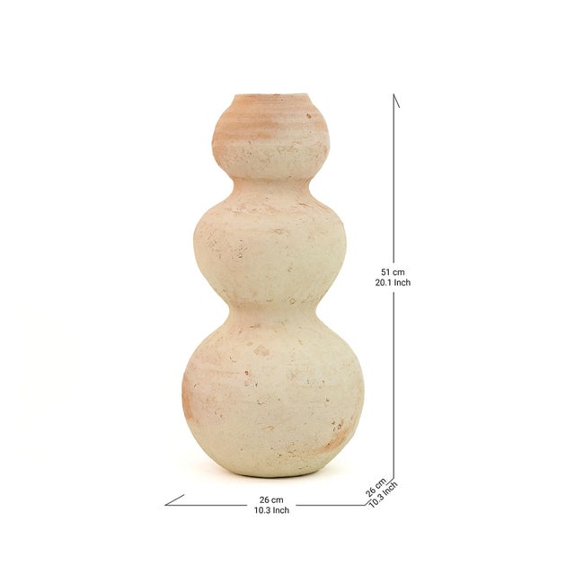 Tamegroute pottery vase, harmoniously shaped into a sphere with raw white and delicate Terracotta nuances, is handcrafted...