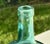 Early 20th Century Viresa Handblown Glass Bottle Made in Spain and exported to France for sale. A luminous example of...