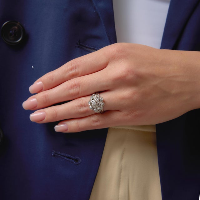 This elegant Mid Century French cocktail ring showcases a refined arrangement of single cut diamonds, offering a soft,...