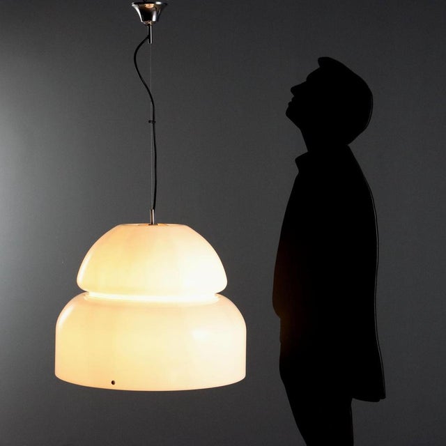 Vintage ceiling lamp with large diffuser made of white methacrylate. This piece is attributed to the mentioned...