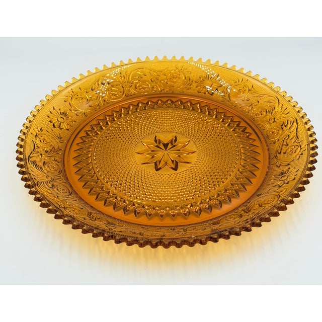 Timeless elegance of this stunning vintage Indiana Glass Tiara Amber Sandwich Basket! This exquisite piece, signed by...