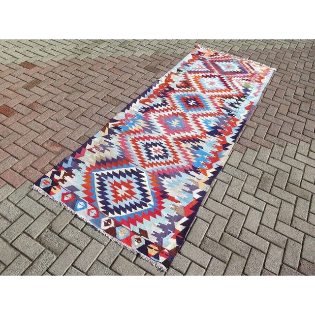 This beautiful, traditional vintage, hand knotted Turkish runner is approximately 60 years old. It is handmade of very...