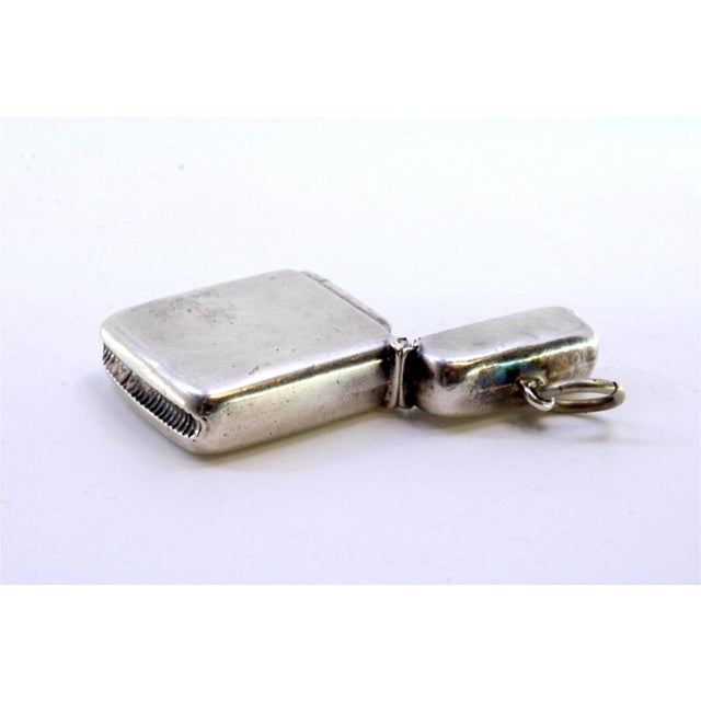Plain Silver Matchbox with Hanging Ring, in Very Good conditions. Designed 1920 to 1949 This piece has an attribution...