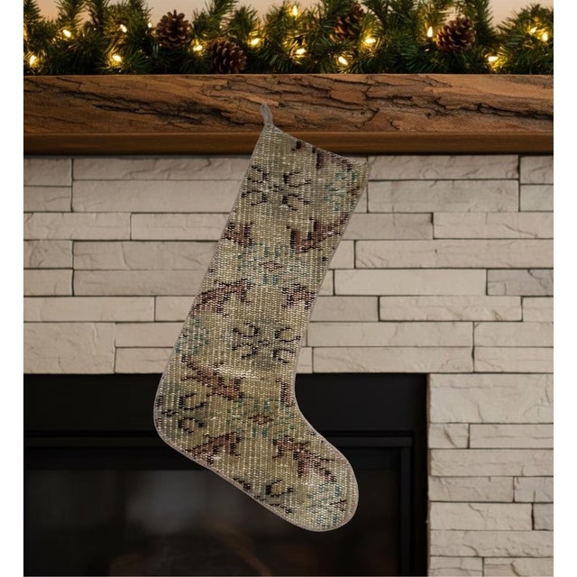 This one-of-a-kind Christmas stocking is hand-cut from a genuine vintage wool kilim in a striking sage green and olive...