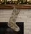 This one-of-a-kind Christmas stocking is hand-cut from a genuine vintage wool kilim in a striking sage green and olive...