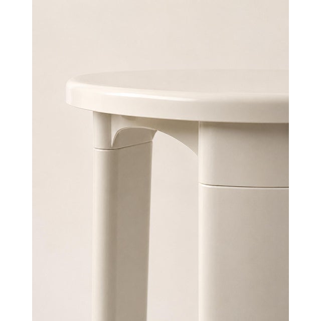 Minimalist stool with a round seat and thick legs. Modern and clean design, ideal as an end table, side table, or...
