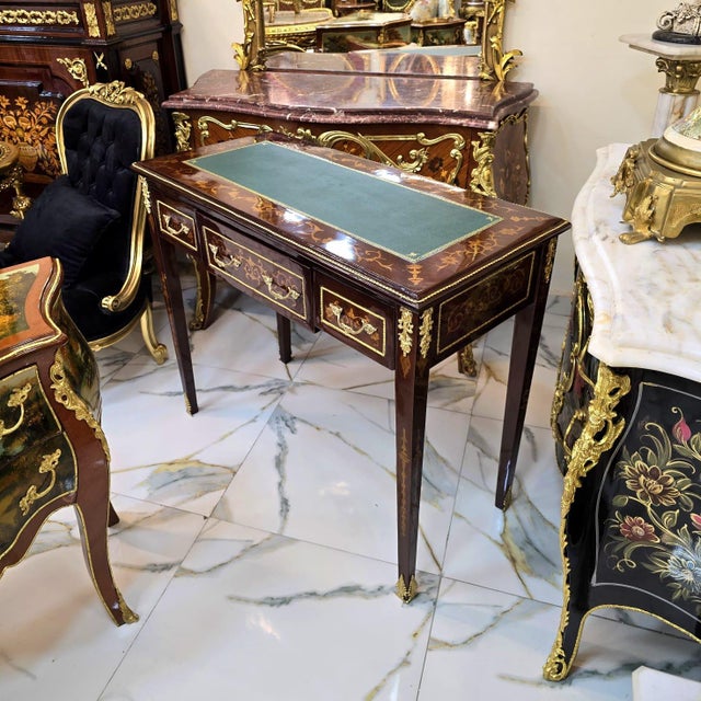 Elevate your workspace with this exquisite French Louis XVI writing desk, masterfully handcrafted from premium hardwood...