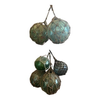 Antique Japanese Glass Fishing Floats – Hand‑Blown Green Glass With Rope Netting For Sale