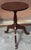 A 19th-century candle stand or small tea table or wine table featuring a circular mahogany top supported by a central...