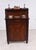 Elegant English Regency side cabinet or small chiffonier in richly figured mahogany The upper section with a raised...
