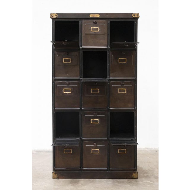 This industrial steel filing cabinet with fifteen flaps was made in italy around the mid-20th century. Designed to...