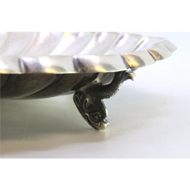 Shell-Shaped Bowl with Fish-Shaped Feet, in Very Good conditions. Designed 1920 to 1949 This piece has an attribution...