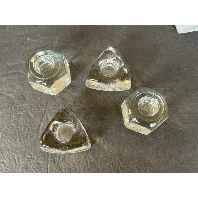 Place colorful mismatched candlesticks in this set of mismatched modern glass ice cube candle holders for a festive...