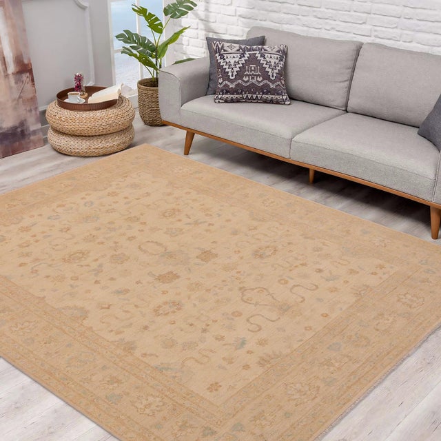 "Enhance the ambiance of your home with this magnificent Persian-influenced Turkish hand-knotted rug made by skilled...