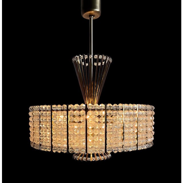 A very rare, representative, elegant, and timelessly modern vintage Mid-Century chandelier with a diameter of 39 cm,...