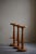 A charming set of three round bar stools crafted from solid oak, showcasing a sleek, hourglass-shaped silhouette. These...