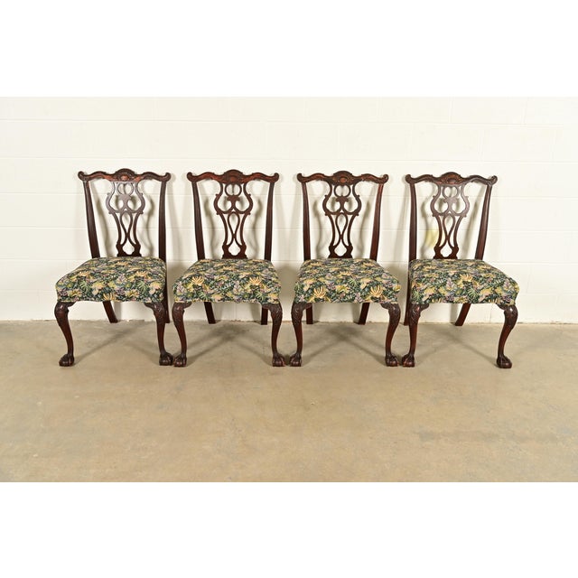 An outstanding set of four Chippendale or Georgian style dining chairs By Romweber USA, Circa 1920s Carved solid mahogany...