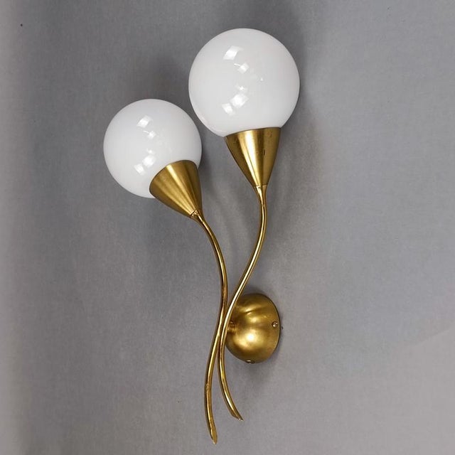 Set of 3 cherry-shaped brass and white glass wall lamps, 1950s design. Brass frame, spherical milky white glass...