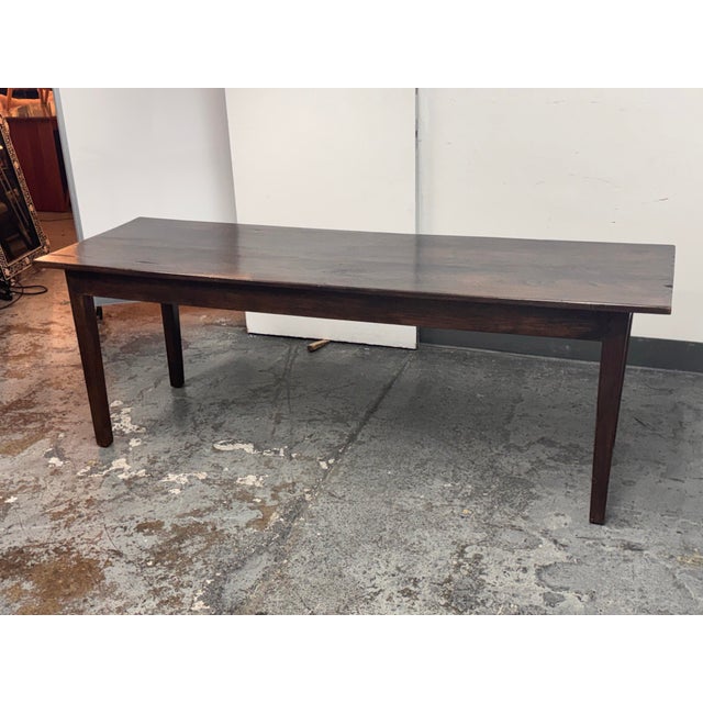 Design Plus Gallery presents a Vintage Rustic Wood Farmhouse Dining Table. Constructed from wood, the table has a...