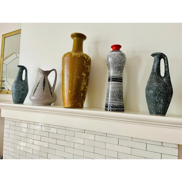 A Stunning Modernist high gloss glazed Vessel. This 1950s gem features a black and white linear/ speckled finish, topped...
