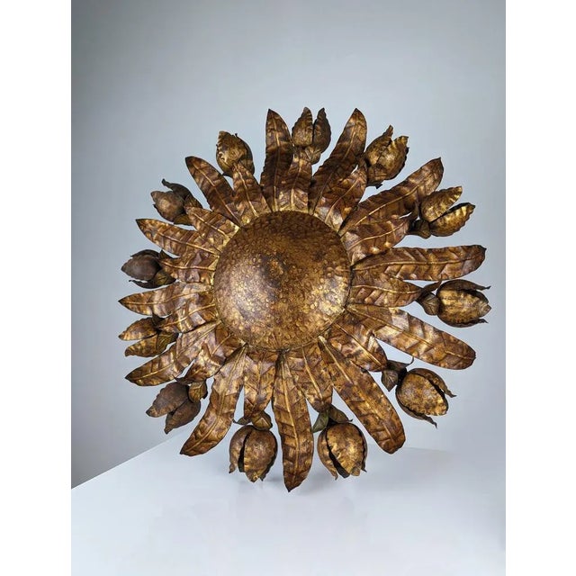 Spectacular completely original mid-century ceiling lamp in the shape of a sun with leaves and 12 flowers that are both...