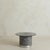 A sculptural Italian coffee table from the 1970s. The round smoked glass top, measuring 26 inches in diameter, rests on a...