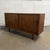 A compact Danish teak cabinet designed by Carlo Jensen for Poul Hundevad, dating to the 1960s. The cabinet has a clean,...