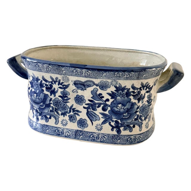 Elegant Chinese blue and white ceramic jardinière/cachepot in a distinctive rectangular footbath form, richly decorated...