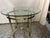Very clean La Barge oval polished brass and bevelled glass top table. Table features decorative feet and top. No pitting...