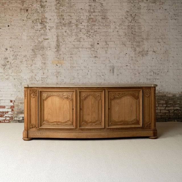 Make a refined statement with this 1940s French oak sideboard with marble top by Christian Krass, a beautifully crafted...