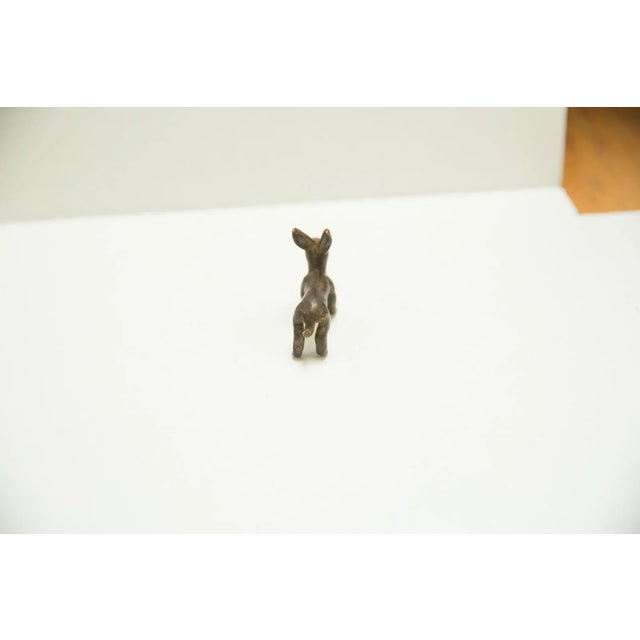 :: Vintage circa mid 20th century African bronze casting of a small rabbit that is unusual and hard to find! This is an...