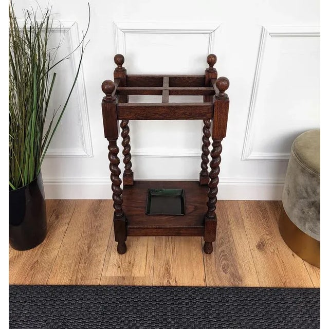 Beautiful and elegant walnut umbrella stand from Tuscany. The top is decorated with lovely tall finials and follows down...