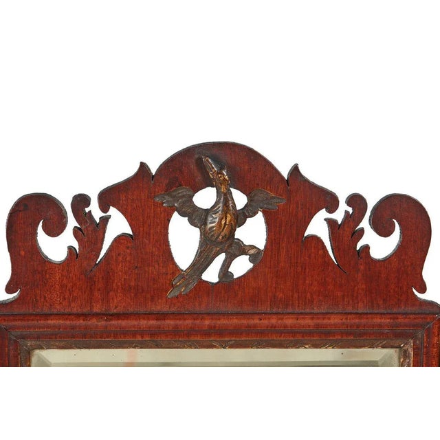 George iii mahogany wall mirror complete with it's gilded ho ho bird and original plate mirror, surrounded by fretted...