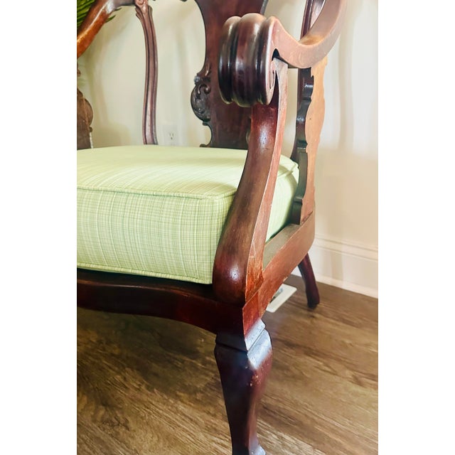 Elevate your space with this classic Queen Anne style armchair. Crafted from rich mahogany, it features elegant scrolled...
