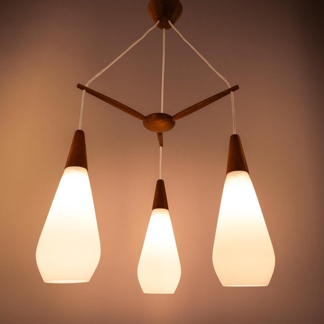 Scandinavian Pendant Lamp in Teak and 3 Matt White, Drop-Shaped Glass Shades, 1960s For Sale - Image 6 of 7