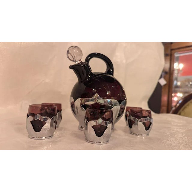 The height of Art Deco Farberware and Cambridge glass ball jug decanter with stopper and 6 shot cordials in aubergine...