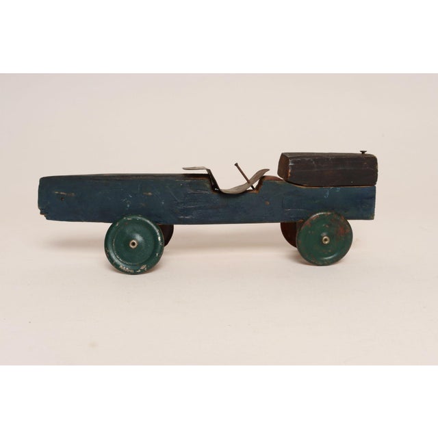 Circa mid-1950s Pinewood Racer, which, since 1953, were sold as blocks of wood with accessories for boy scouts to craft /...
