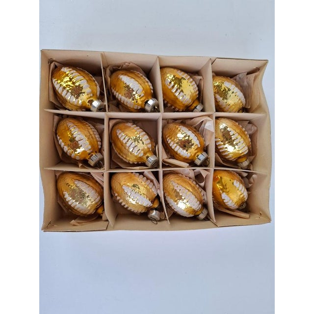 Elegant set of twelve vintage Czechoslovakian glass Christmas ornaments, dating to circa 1970. Each ornament is hand...