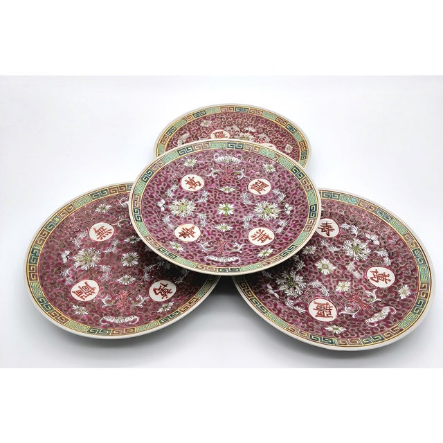 This is a set of 9 inch Chinese Mun Shou plates. These medium-sized plates are adorned with traditional Chinese longevity...