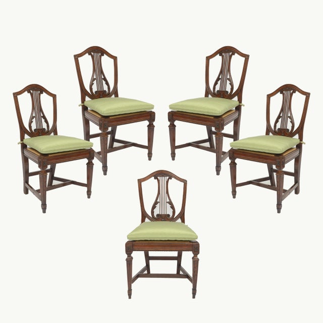 Set of Five Italian Walnut Dining Chairs Sheilded back with lyre central design Rush caned seats over fluted legs with...